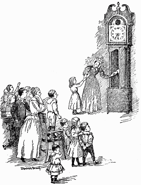 children lookiing at clock