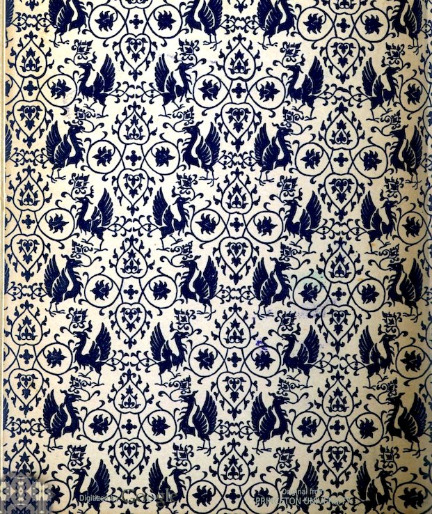 An endpapper with repeating, intricate blue-and-white pattern featuring stylized birds and foliate designs.