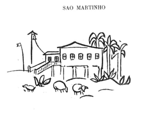 Edifício de
fazenda com sino e bandeira ao lado, cercado por palmeiras e arbustos,
com animais pastando em frente.