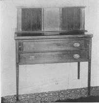 One of Sheraton's charming desks, with sliding doors made
of thin strips of wood glued on cloth.