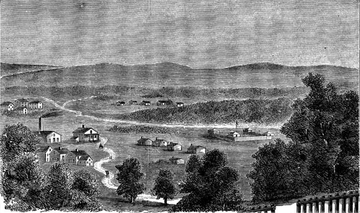 White clapboard buildings
of various sizes and a stockaded fort.