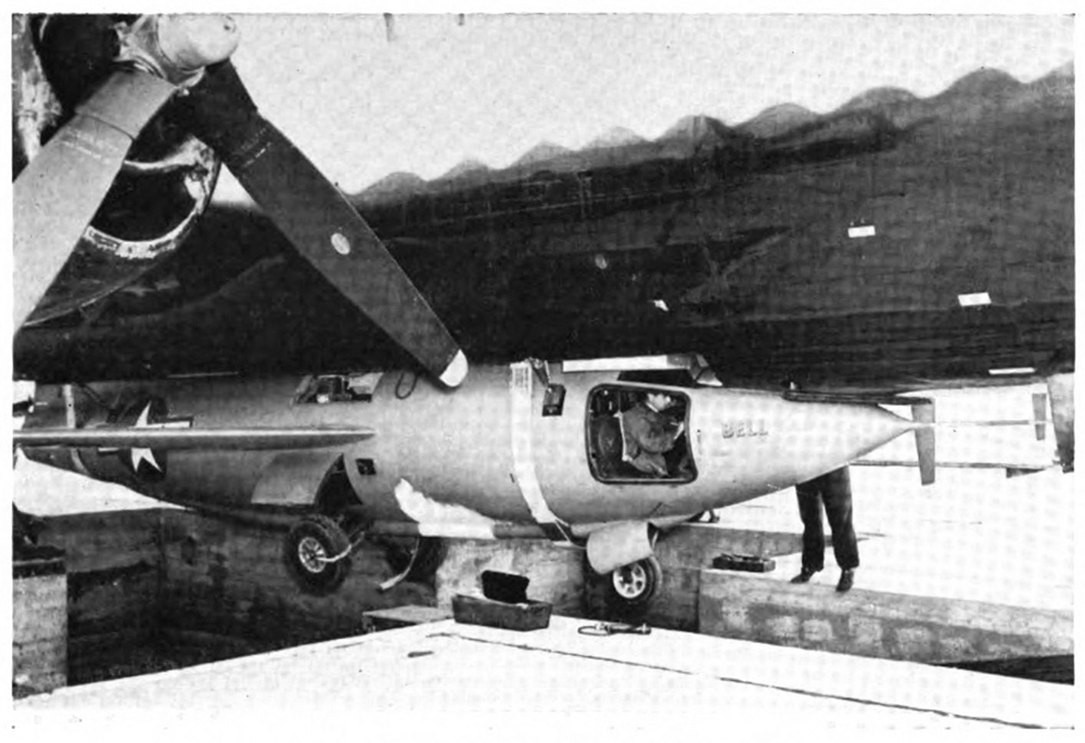 An airplane attached to the bottom of a larger airplane