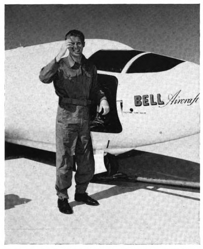 A man standing in front of an airplane