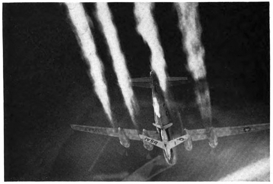 A plane in flight with four contrails